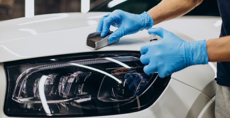 Man working car detailing and coating car